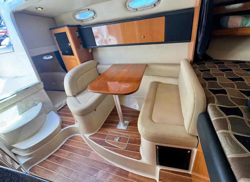 Slide: The Image of Interior of 2011 Chaparral 290 Signature with dining table and seating area. - 17
