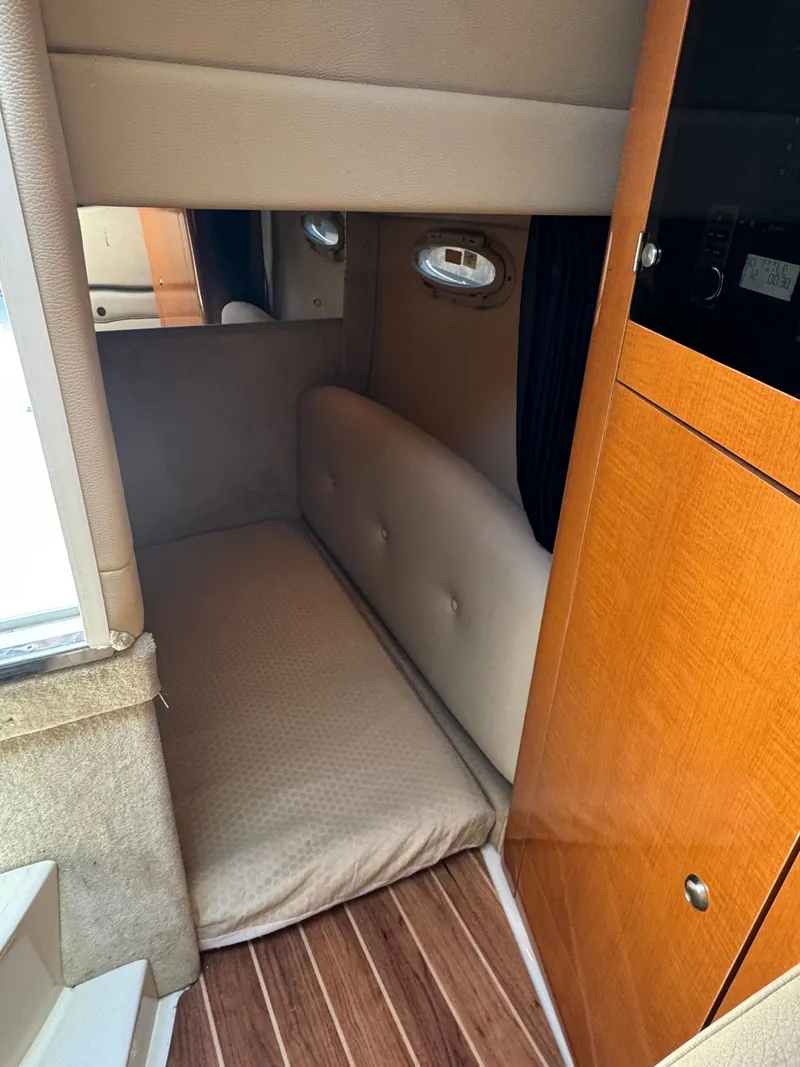 Slide: The Image of Interior of 2011 Chaparral 290 Signature with sleeping area. - 18