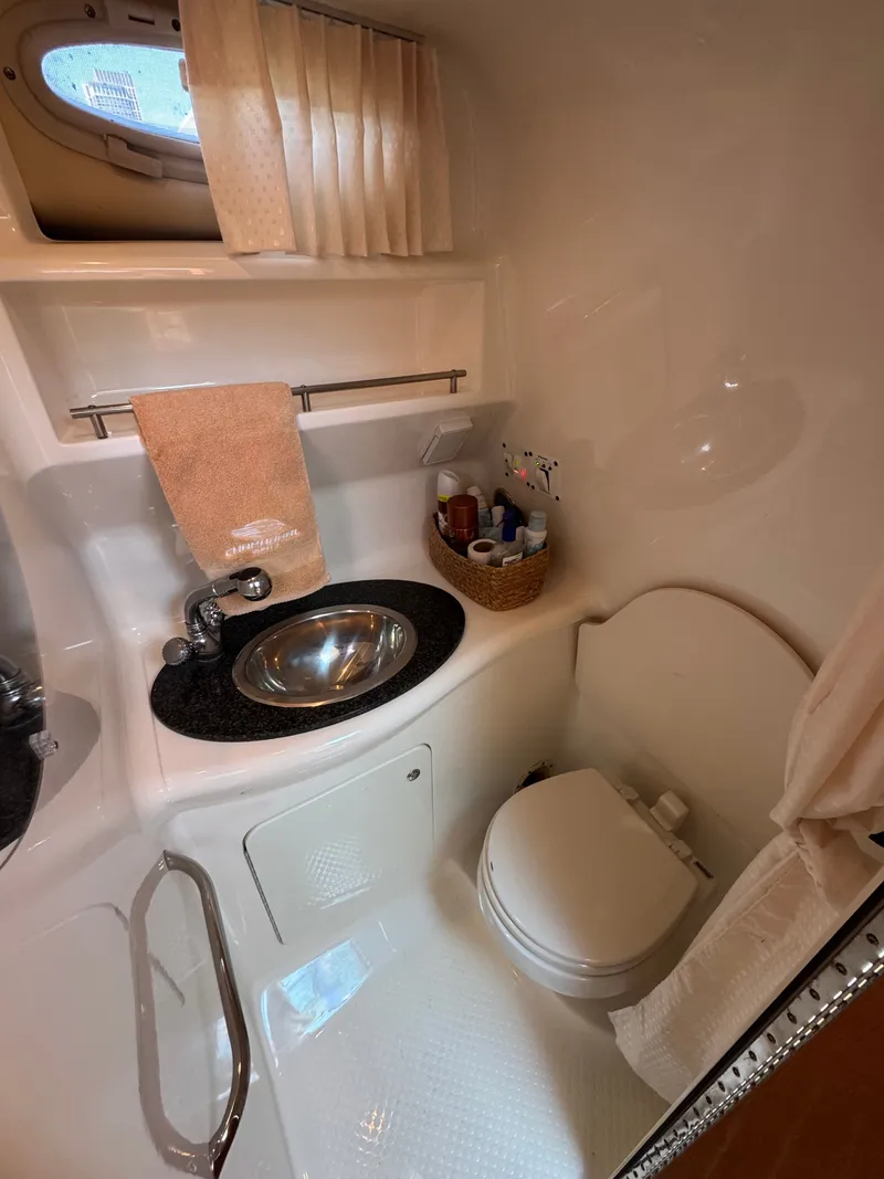 Slide: The Image of Interior of 2011 Chaparral 290 Signature with sink and toilet. - 19