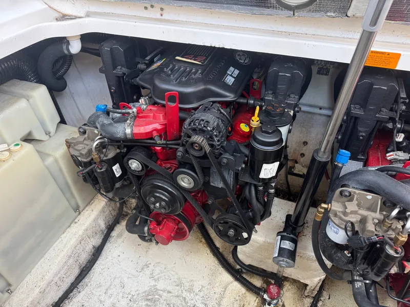 Slide: The Image of Engine compartment of a 2011 Chaparral 290 Signature boat. - 21