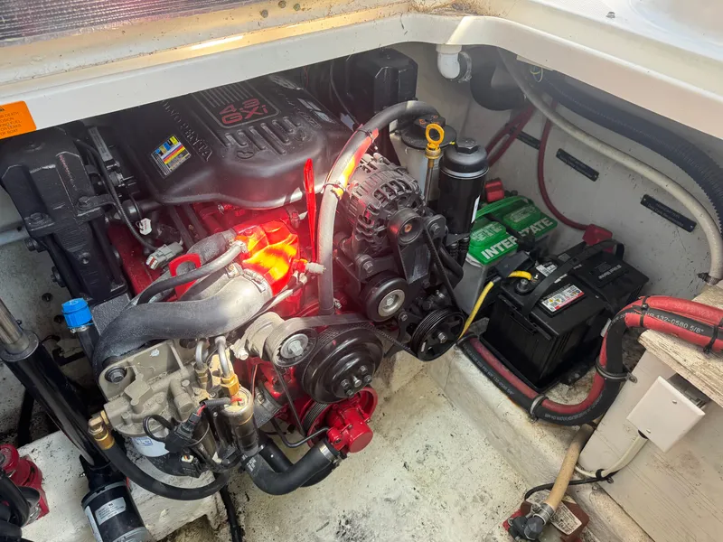 Slide: The Image of Engine compartment of a 2011 Chaparral 290 Signature with battery and wiring. - 22