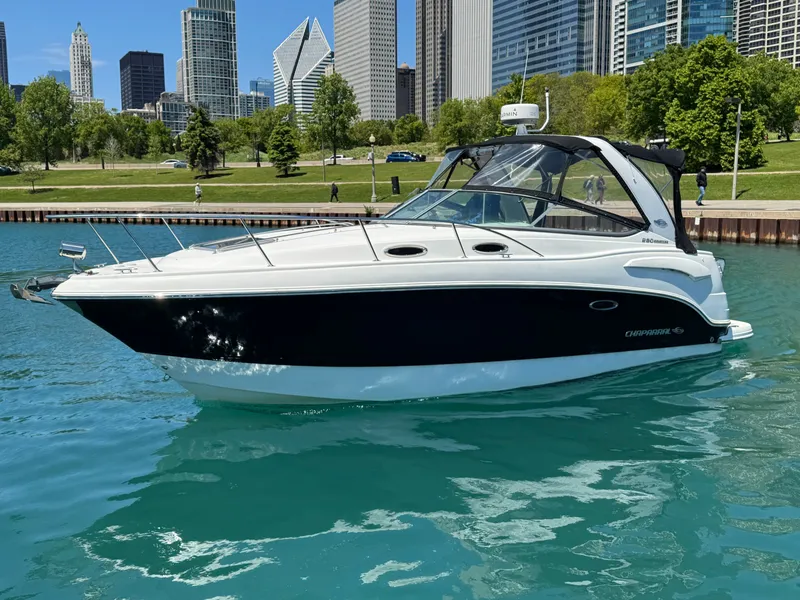 Slide: The Image of 2011 Chaparral 290 Signature boat in urban waterfront setting. - 23