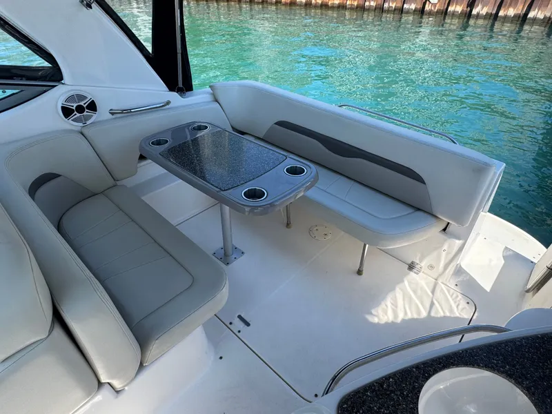Slide: The Image of Interior of 2011 Chaparral 290 Signature with seating area and table. - 4