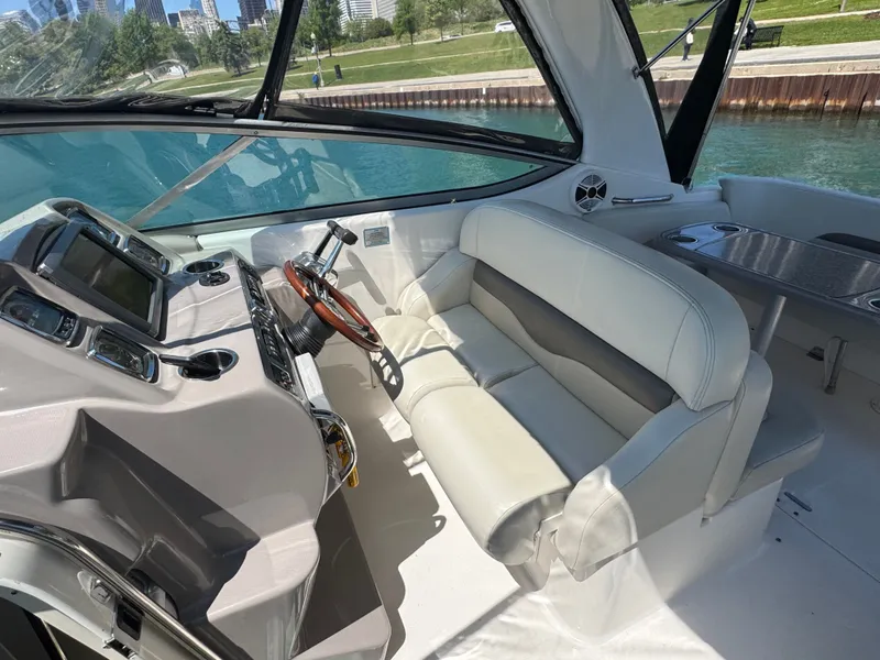 Slide: The Image of Interior of 2011 Chaparral 290 Signature with helm and seating area. - 7