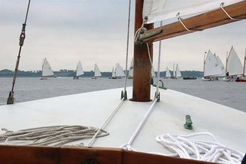 Slide: The Image of Sailboats on a calm lake, viewed from a 1997 COMPASS CLASSIC Catboat deck. - 1