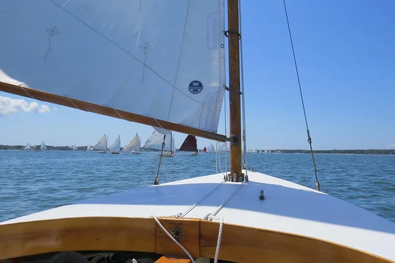 Slide: The Image of Sailing view from 1997 COMPASS CLASSIC Catboat, with other boats on the horizon. - 15
