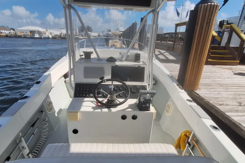 Slide: The Image of Interior view of a 2001 Dusky 252 Open Fisherman boat at the dock. - 11