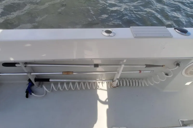 Slide: The Image of Dusky 252 Open Fisherman 2001 with fishing rod holder and water hose. - 17
