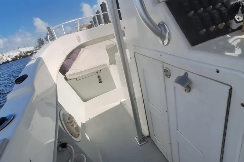 Slide: The Image of 2001 Dusky 252 Open Fisherman boat interior with seating and control panel. - 18