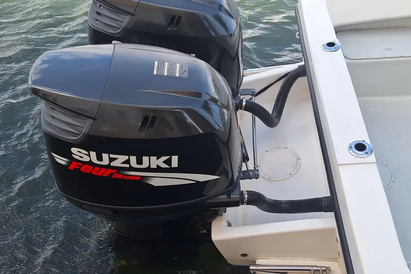 Slide: The Image of Suzuki outboard motors on a Dusky 252 Open Fisherman boat. - 5