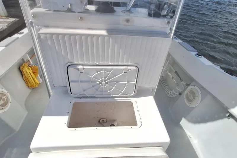 Slide: The Image of Dusky 252 Open Fisherman 2001, boat cabin with storage compartment. - 7