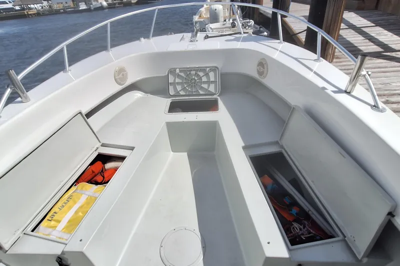 Slide: The Image of Dusky 252 Open Fisherman 2001 with storage and safety equipment. - 9