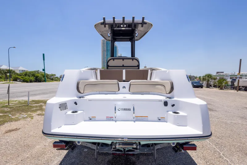 Slide: The Image of 2025 Yamaha Boats 255 FSH Sport E, rear view, showcasing sleek design and spacious seating. - 12