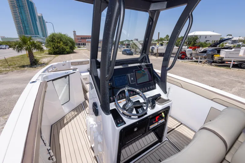 Slide: The Image of 2025 Yamaha Boats 255 FSH Sport E cockpit with modern controls and navigation system. - 23