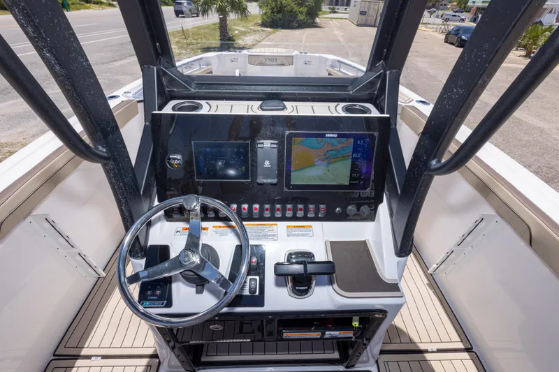 Slide: The Image of 2025 Yamaha Boats 255 FSH Sport E dashboard with navigation display and controls. - 25