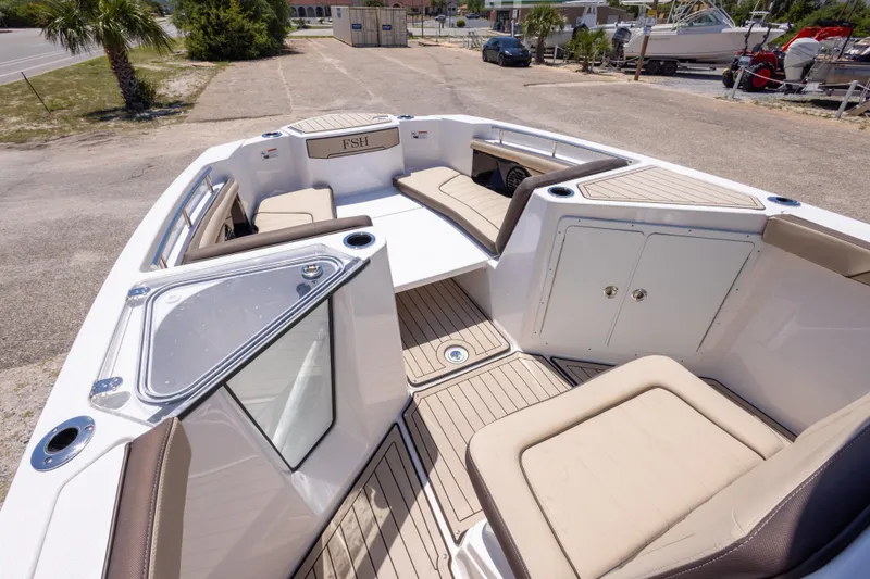 Slide: The Image of 2025 Yamaha Boats 255 FSH Sport E interior with spacious seating and modern design. - 29