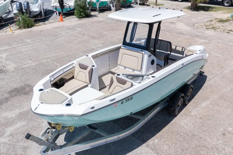 Slide: The Image of 2025 Yamaha Boats 255 FSH Sport E on trailer, showcasing sleek design and spacious interior. - 3