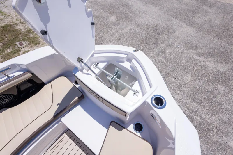 Slide: The Image of 2025 Yamaha Boats 255 FSH Sport E anchor compartment with seating and cup holders. - 31