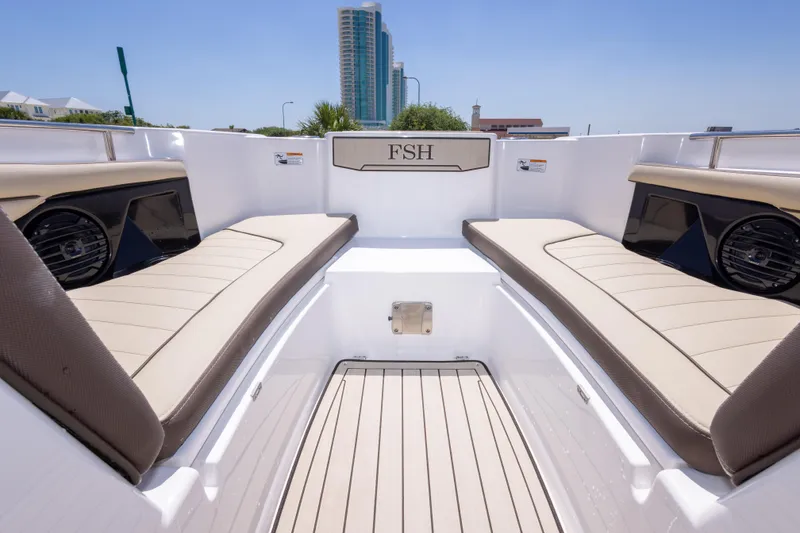 Slide: The Image of 2025 Yamaha Boats 255 FSH Sport E interior with beige seating and modern design. - 38