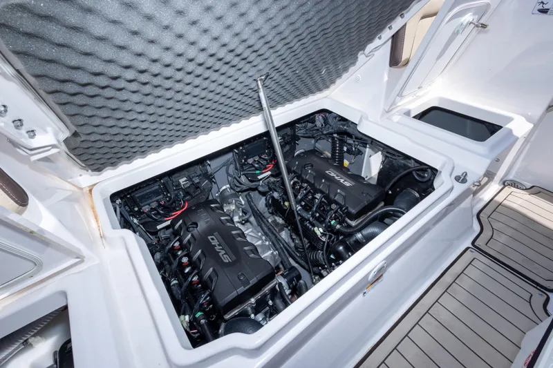 Slide: The Image of Engine compartment of 2025 Yamaha Boats 255 FSH Sport E, showcasing dual engines. - 50