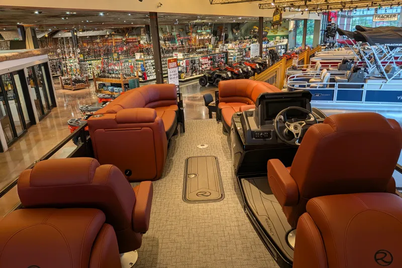 Slide: The Image of Luxurious 2026 Regency 230 DL pontoon boat interior with plush seating and modern dashboard. - 4