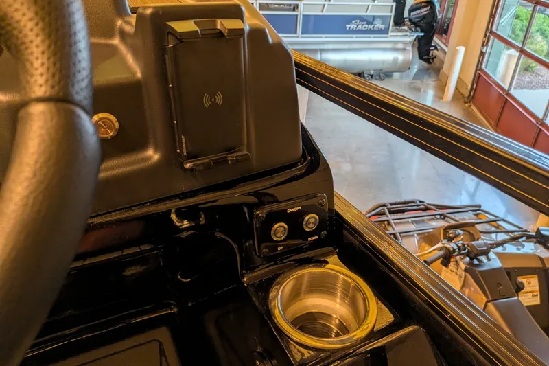 Slide: The Image of Control panel of 2026 Regency 230 DL boat with wireless charging and cup holder. - 10