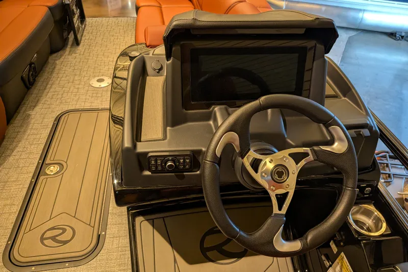 Slide: The Image of Steering console of 2026 Regency 230 DL boat with modern dashboard and controls. - 9