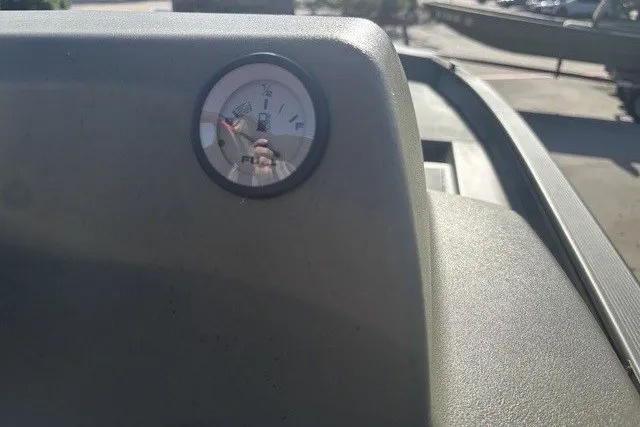 Slide: The Image of Fuel gauge on 2026 Tracker Grizzly 1754 SC boat dashboard in sunlight. - 6