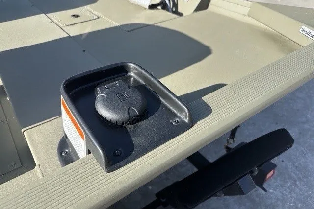 Slide: The Image of 2026 Tracker Grizzly 1754 SC boat fuel cap on deck, close-up view. - 2