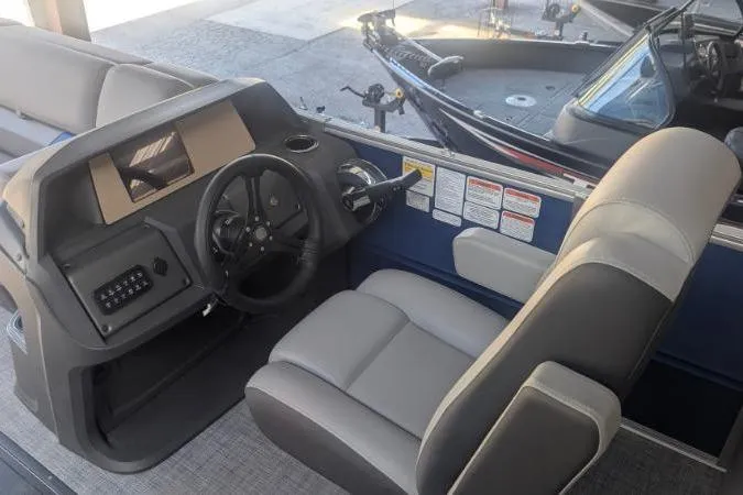Slide: The Image of Interior view of 2026 Sun Tracker Party Barge 22 RF XP3 boat cockpit. - 3