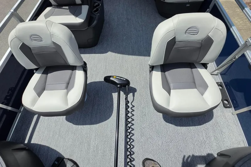 Slide: The Image of 2026 Sun Tracker Bass Buggy 18 DLX interior with two cushioned seats and a trolling motor. - 22