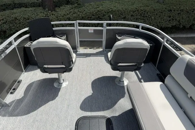 Slide: The Image of 2026 Sun Tracker Fishin' Barge 22 XP3 interior with seating and helm. - 12