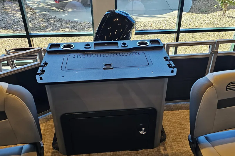 Slide: The Image of 2026 Sun Tracker Sportfish 24 XP3 boat interior with fishing station and seating. - 14