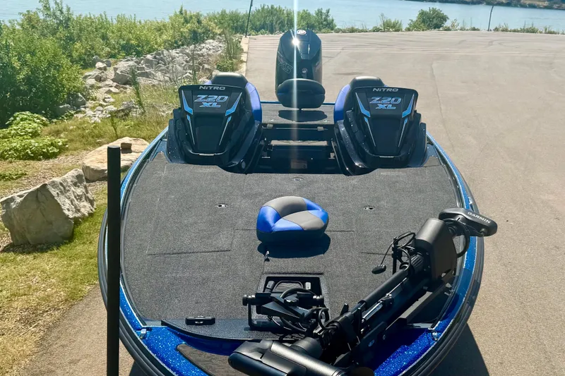 Slide: The Image of 2026 Nitro Z20 XL Pro boat with dual seats and advanced equipment by a lakeside. - 16
