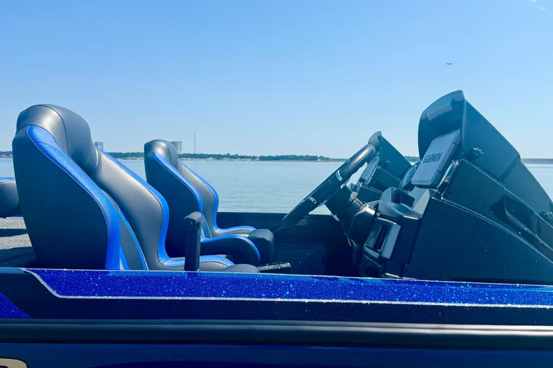 Slide: The Image of 2026 Nitro Z20 XL Pro boat interior with blue seats and Garmin navigation. - 2