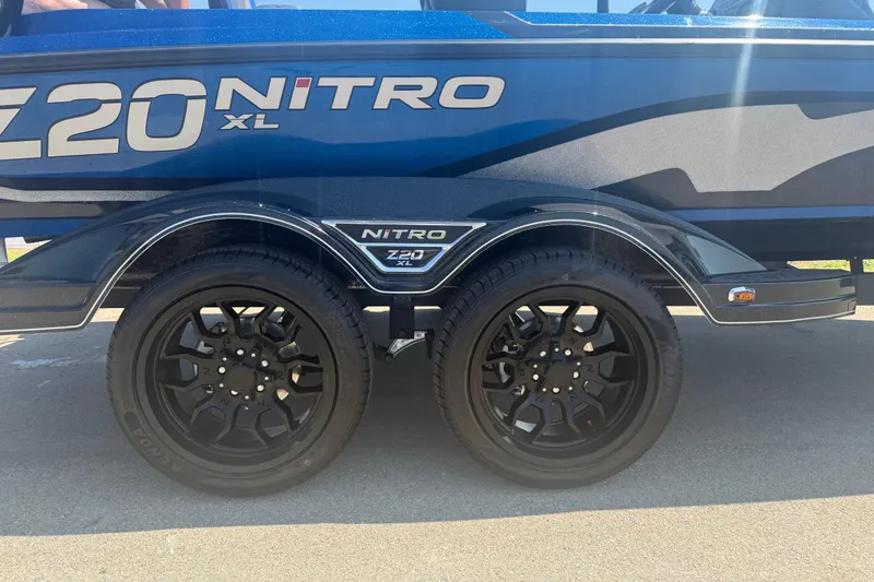 Slide: The Image of 2026 Nitro Z20 XL Pro boat trailer with sleek black wheels and bold branding. - 6