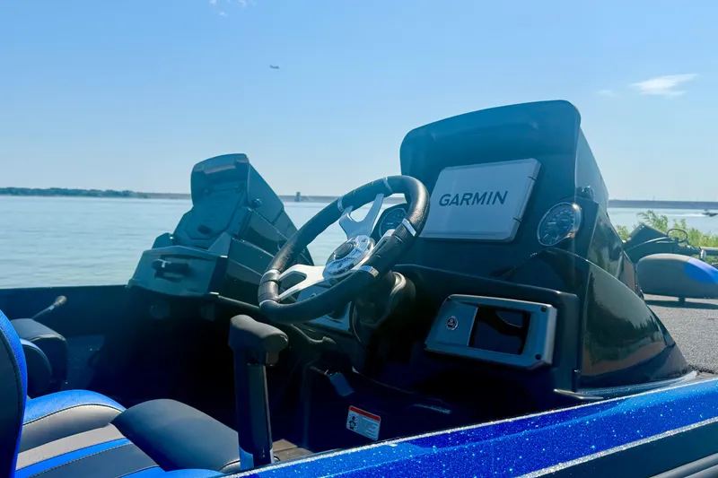 Slide: The Image of 2026 Nitro Z20 XL Pro boat dashboard with Garmin navigation, overlooking serene waters. - 8