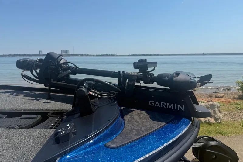 Slide: The Image of 2026 Nitro Z20 XL Pro boat with Garmin equipment by a serene lake. - 4