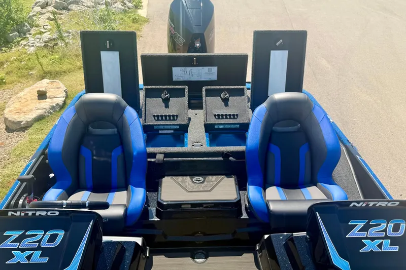 Slide: The Image of 2026 Nitro Z20 XL Pro boat interior with blue seats and storage compartments. - 15