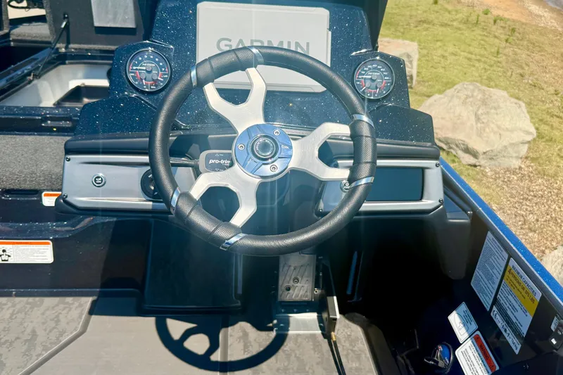 Slide: The Image of Steering wheel of 2026 Nitro Z20 XL Pro boat with Garmin display and gauges. - 13