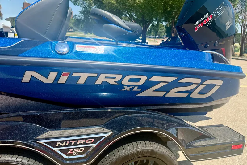Slide: The Image of 2026 Nitro Z20 XL Pro boat with Mercury Pro XS engine, parked outdoors. - 19