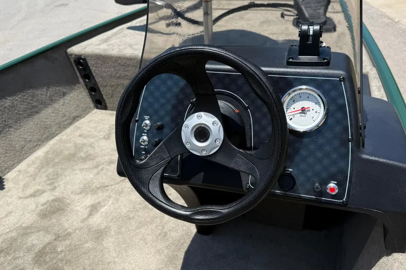 Slide: The Image of Steering console of 2026 Tracker Bass Tracker Classic Limited boat with RPM gauge. - 2
