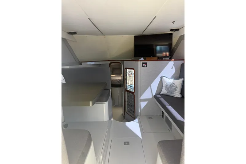 Slide: The Image of Interior of 1987 Phoenix 34 SFX Convertible boat with seating and modern amenities. - 17