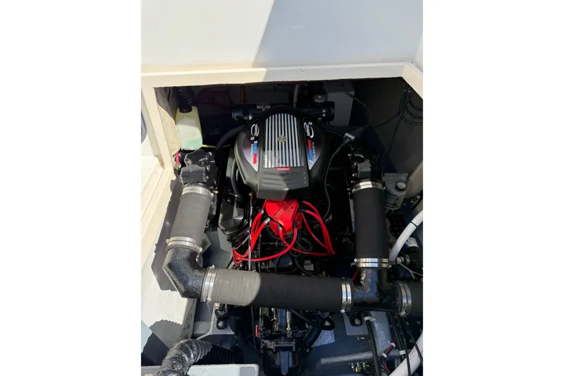 Slide: The Image of Engine compartment of a 1987 Phoenix 34 SFX Convertible boat, showcasing detailed components. - 29