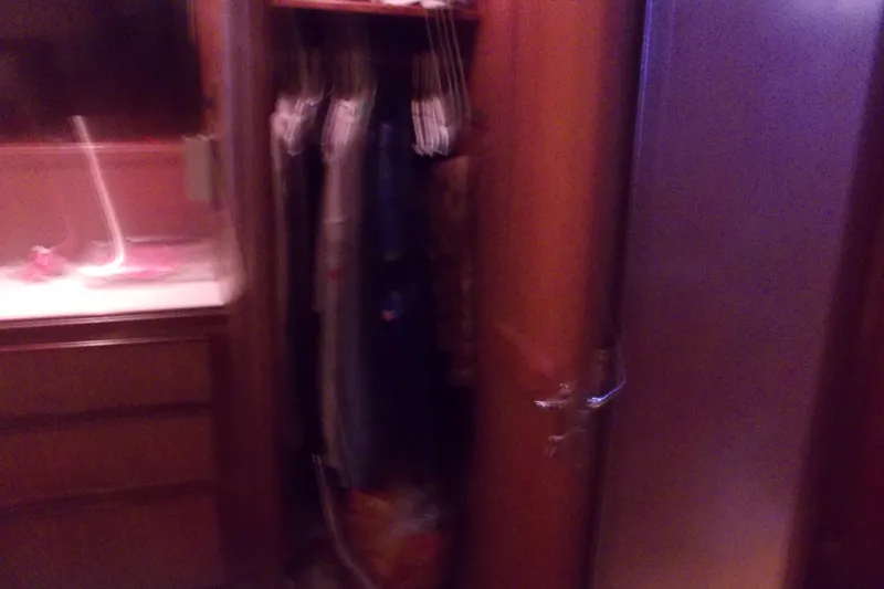 Slide: The Image of Interior of 1982 Hatteras 46 Convertible yacht with closet and storage space. - 10