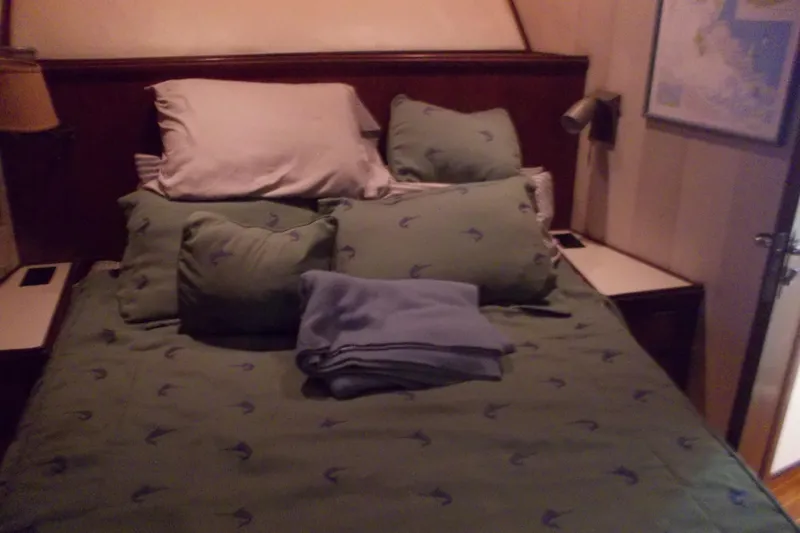 Slide: The Image of Cozy bedroom with green bedding on 1982 Hatteras 46 Convertible yacht. - 11