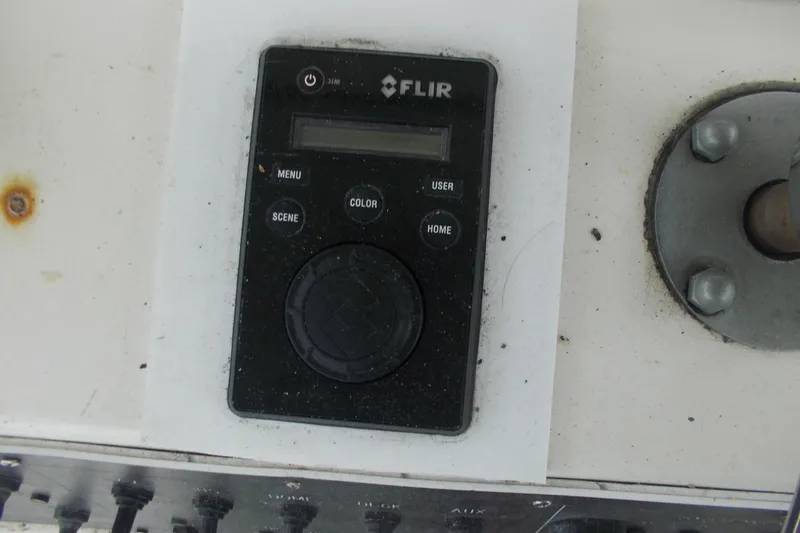 Slide: The Image of FLIR control panel on 1982 Hatteras 46 Convertible boat dashboard. - 21