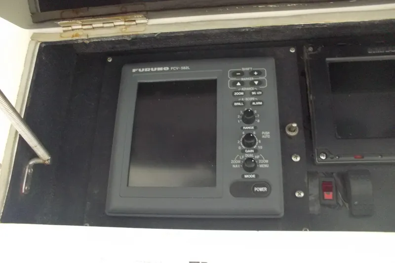 Slide: The Image of Furuno FCV-582L fish finder on 1982 Hatteras 46 Convertible boat dashboard. - 24
