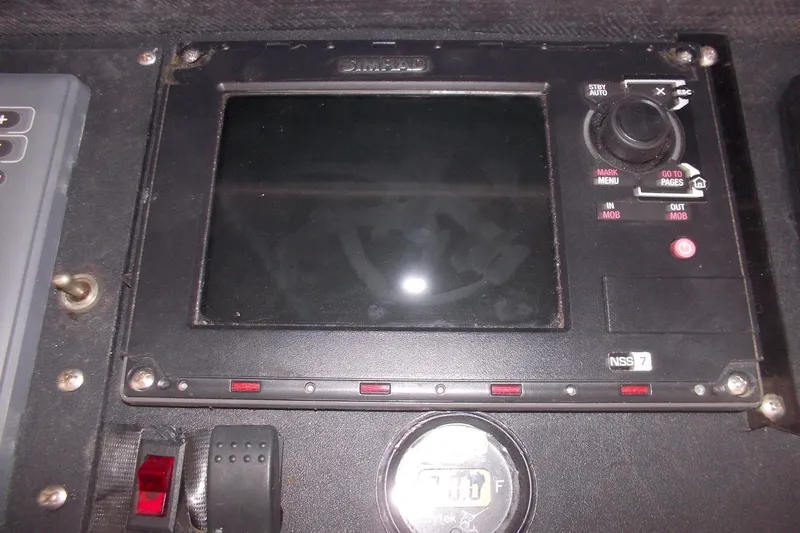Slide: The Image of Control panel of a 1982 Hatteras 46 Convertible boat with navigation display. - 25