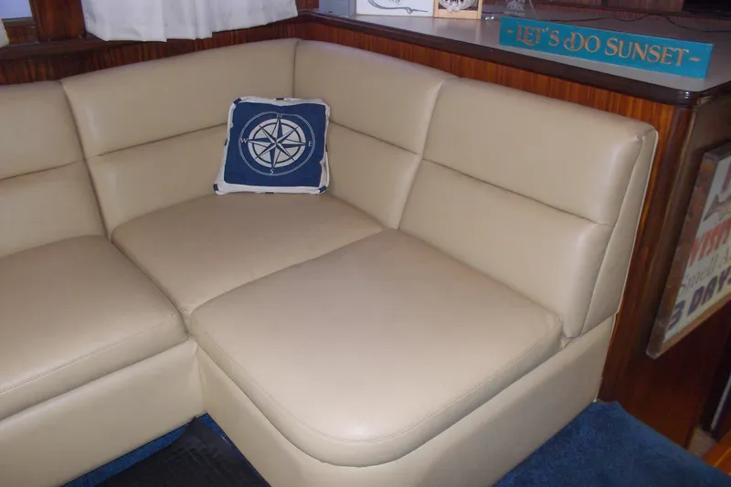 Slide: The Image of Beige leather seating with nautical pillow on 1982 Hatteras 46 Convertible yacht interior. - 3